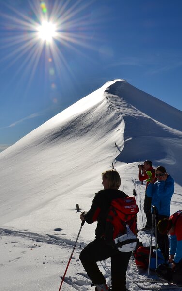 Ski tourers on snow hill