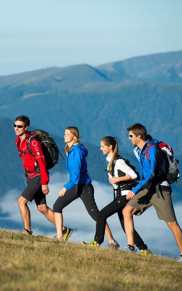 four hikers side by side on a hiking trail | © TVB Kronplatz