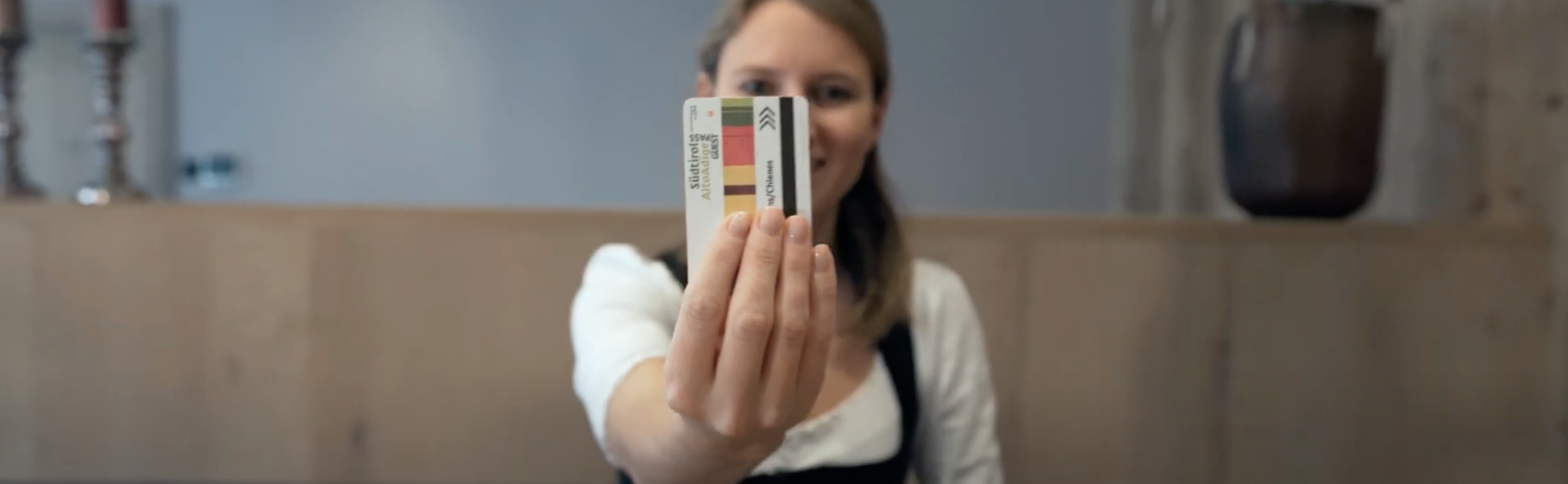 Young woman holding a Holiday Pass
